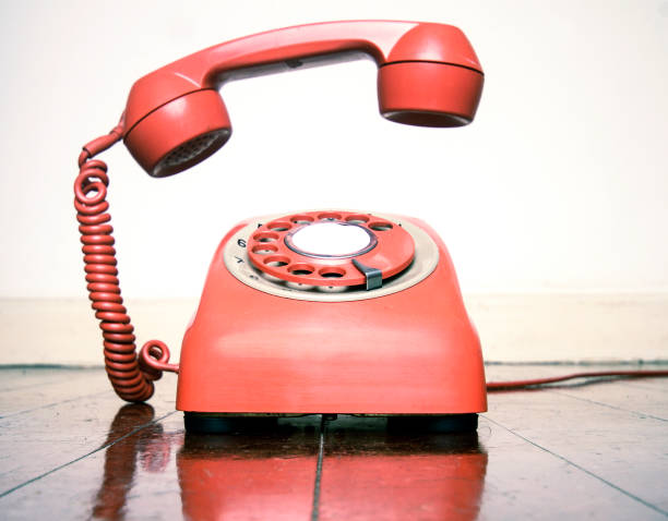 istock retro phone ringing on a old wooden floor 1036235294