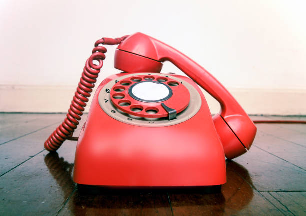 istock vintage red phone off the hook close up 1036235368