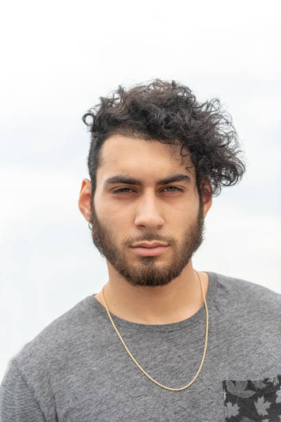 istock Handsome young Hispanic man with serious expression on his face 1036237988