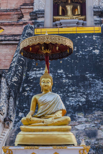 istock sitting golden buddha at Wat Chedi Luang Chiang Mai 1036240622