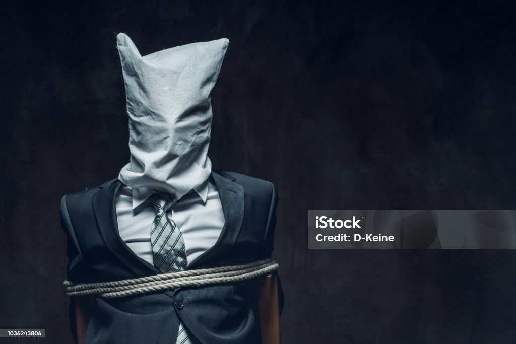 Hostage Portrait of kidnapped businessman. Hostage, slavery concept. Kidnapping Stock Photo