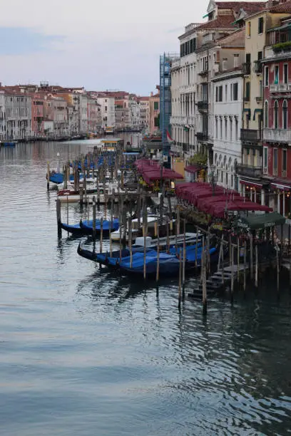 Scenic photo of gondolas in Venice just before the city wakes up