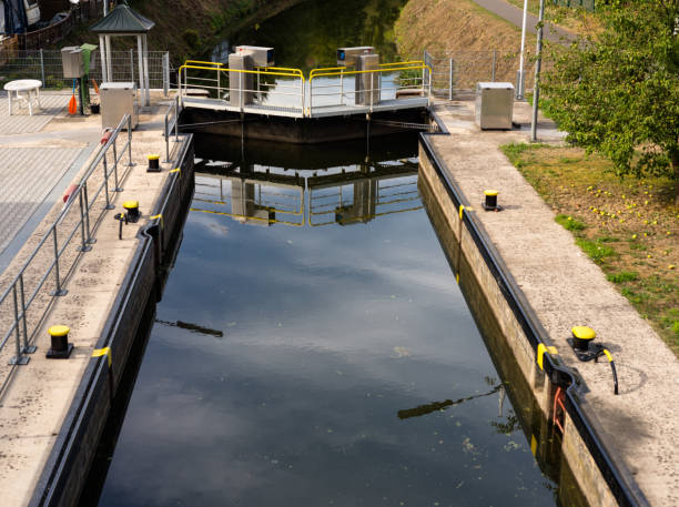 istock A closed water lock on a narrow channel in the woods. 1036249196