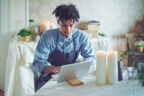 istock Hipster entrepreneur is communicating with his clients online 1036257170