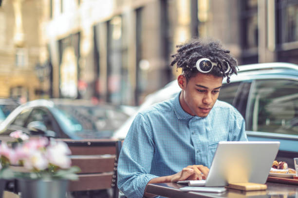 istock Young man is enjoying his breakfast in the city 1036257708