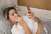 Nervous woman reading telephone message