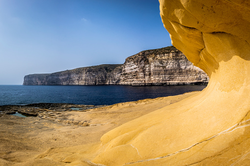 Cliffs, „Wave“ of limestone and Salt pans, nearby Xlendi Tower, Ras il-Bajda, Xlendi, Gozo, Malta