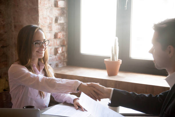 istock Man and woman handshake 1036273900