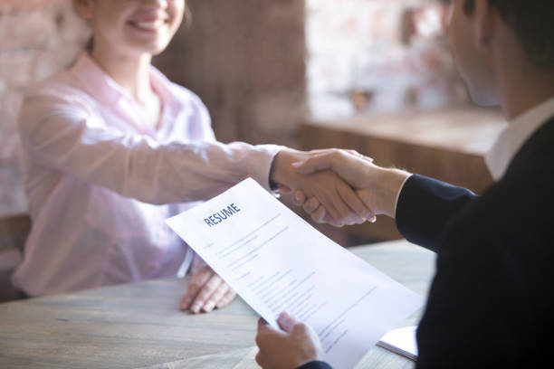 Successfully passed job interview Smiling young woman and man handshake. Businesspeople shaking hands. Human resources, successfully passing the interview, hr concept. Close up resume paper interview event stock pictures, royalty-free photos & images