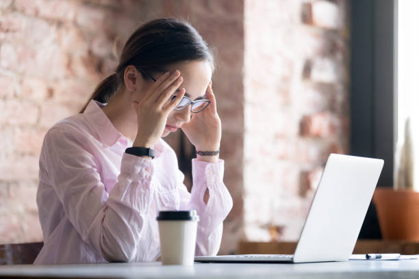 istock Tired woman in office 1036274010