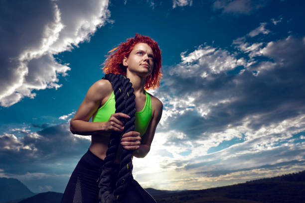 istock active fit woman carrying rope 1036275362