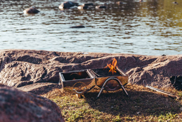 istock Small coal grill warming up in the nature, Helsinki Finland 1036281928