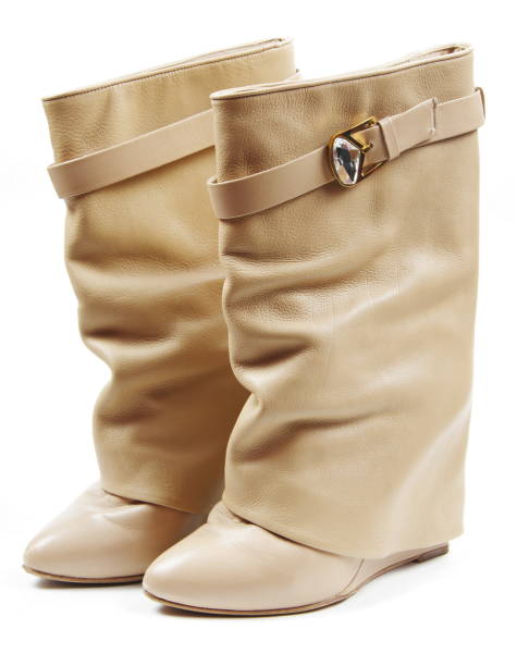 istock Close-Up Of Beige Boots Against White Background 1036286810