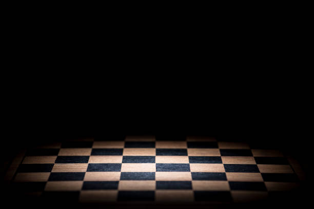 close up of queen chess piece on blue background