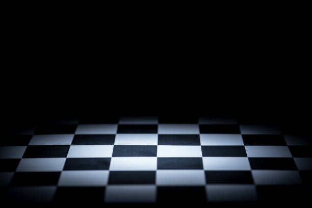 istock Close-Up Of Chess Board Against Black Background 1036290544