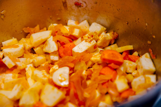 istock Macro Closeup of Cooking Vegetable Curry Stew in a Pot 1036296110