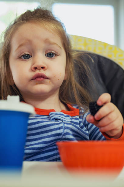 istock Girl Eating Breakfast 1036296648