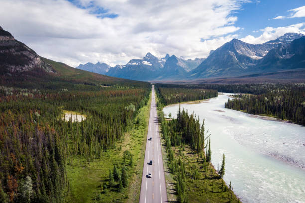 Aerial View of the Famous Icefields Parkway Road Between Banff and Jasper National Parks in Alberta, Canada Aerial view of the famous Icefields Parkway road between Banff and Jasper National Parks in Alberta, Canada. bow river stock pictures, royalty-free photos & images