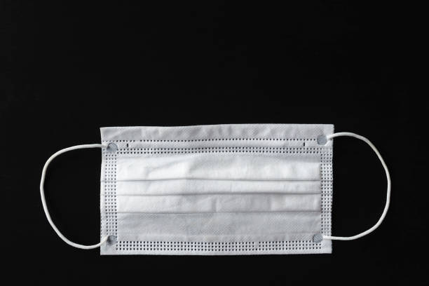 istock Medical mask on a black background. 1036302170