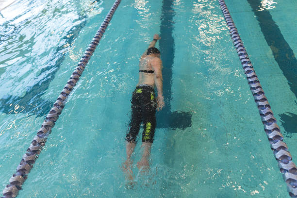 istock Adaptive athlete swims laps in a pool 1036303588