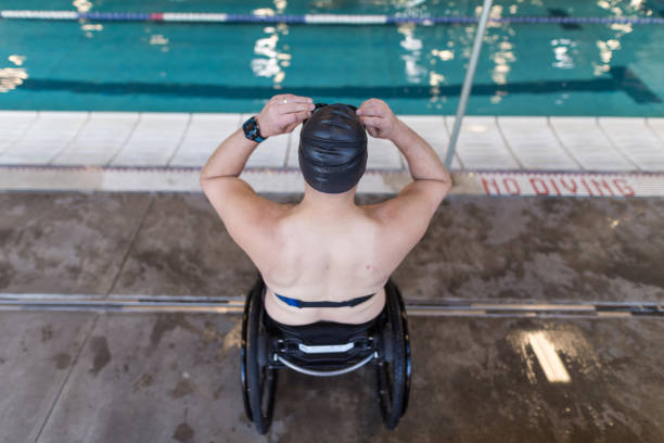 istock Adaptive athlete prepares to swim in a pool 1036303678