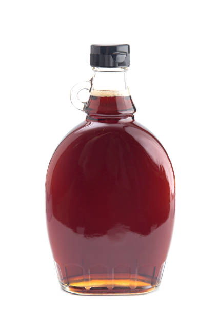 bottle of pure maple syrup on a white background - nobody maple tree deciduous tree tree imagens e fotografias de stock