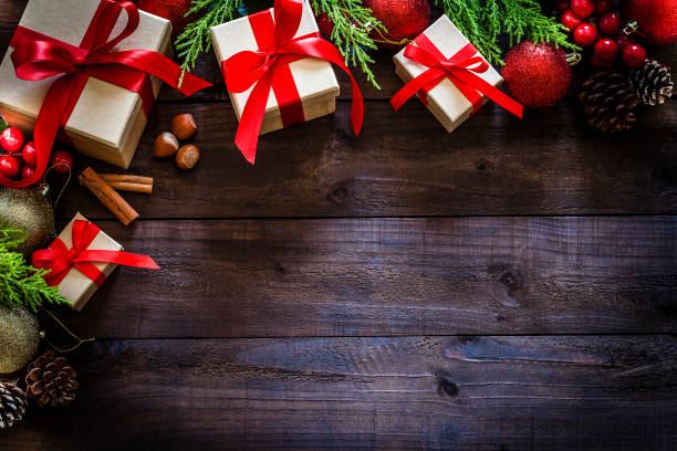 istock Christmas presents on rustic wooden table shot from above 1036313432