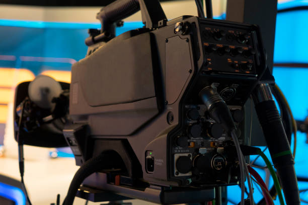 istock Television studio with camera and lights - camera on a crane. Shallow depth of field - focus on camera 1036315532