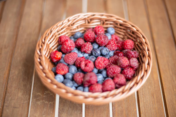 istock blueberries and raspberries in a basket 1036322966
