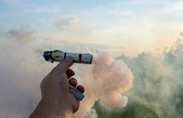 istock Smoke swirl, emits smoke in the man's hand 1036331782