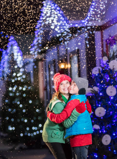 istock Two children, siblings, hugging at winter festival 1036337008