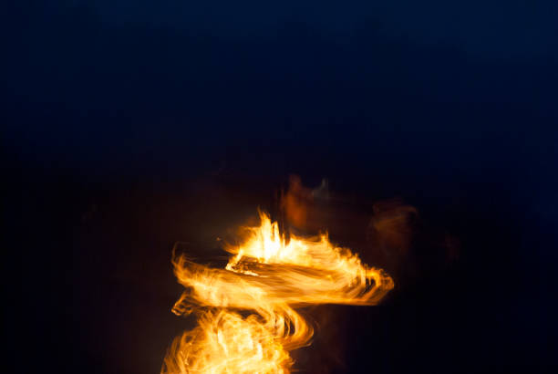 istock Fire flames outdoors on night beach. effect of movement and sweeping. 1036341632
