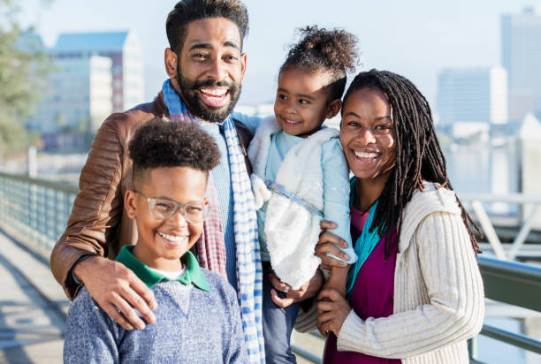 istock Family with two children standing on city waterfront 1036341676