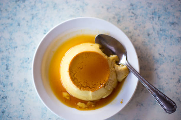 istock Mexican Flan with Spoon, Overhead Shot 1036348936