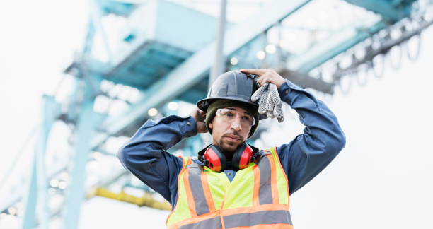 istock Mixed race man working at shipping port 1036355408