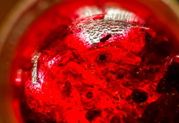 istock Bright translucent red currant jam in a glass jar 1036356032