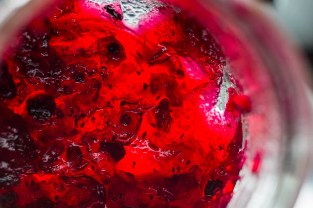 istock Bright translucent red currant jam in a glass jar 1036356062
