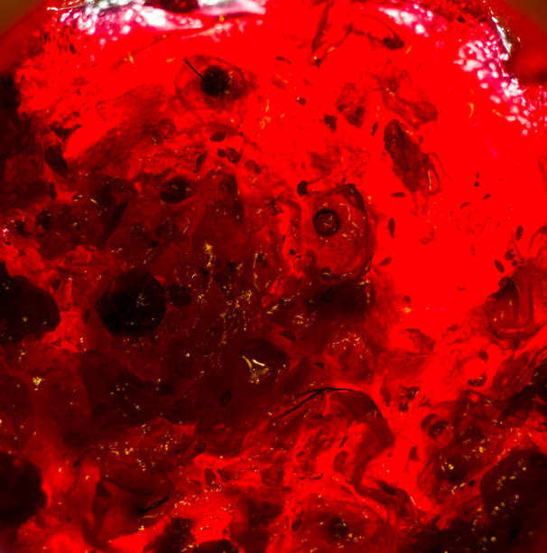 istock Bright translucent red currant jam in a glass jar 1036356302