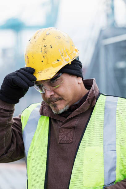istock Hispanic dock worker at shipping port 1036356810