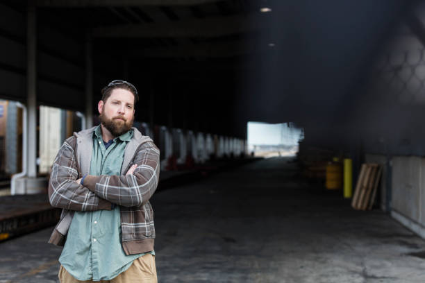 istock Manual worker standing outdoors at shipping port 1036359928