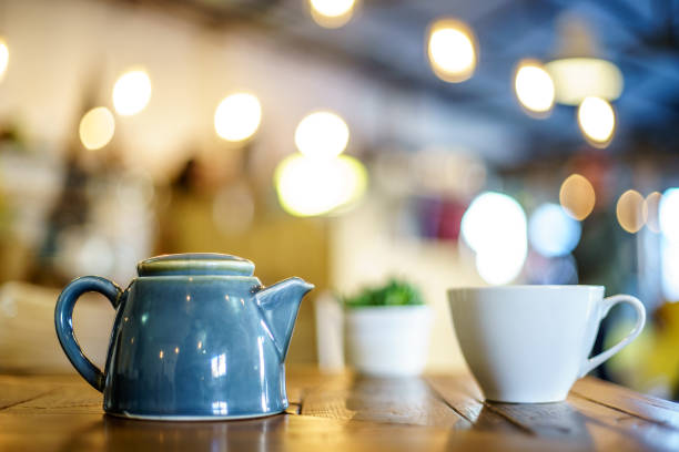 istock Fruit Tea with pot, cactus and candle on wooden table 1036360886
