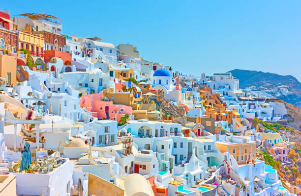 Panoramia of Oia town in Santorini Colorful panoramia of Oia town in Santorini, Greece greece stock pictures, royalty-free photos & images