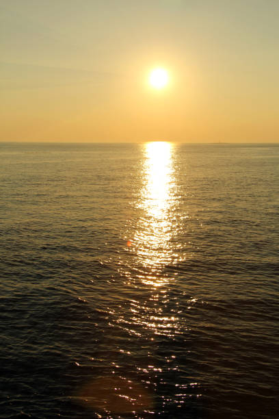 istock beautiful, fiery sunset at the sea 1036364922
