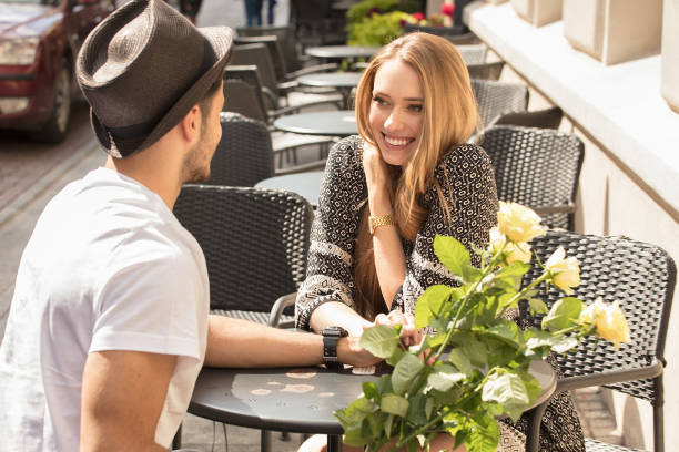 beautiful couple with flowers dating. - 13584 imagens e fotografias de stock