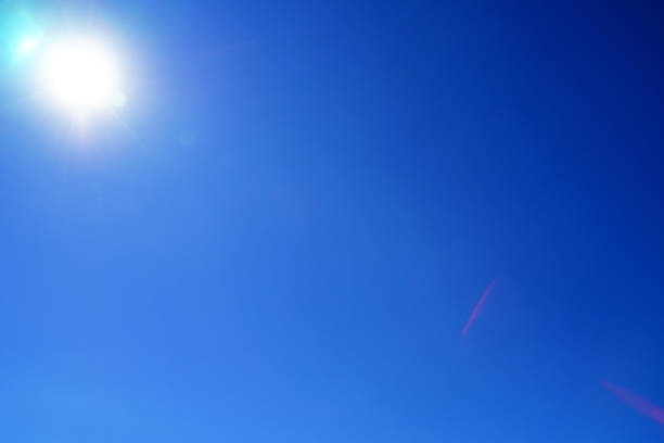 istock blue sky with sun in the corner 1036371304