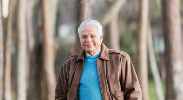 istock Senior man standing outdoors in park 1036382296