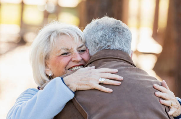 istock Senior couple embracing outdoors 1036386552