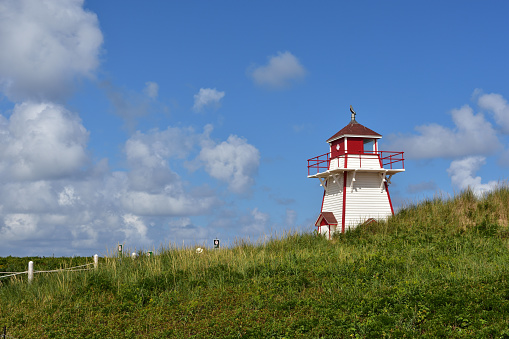 Cavendish is a wild, rugged, beautiful and pristine area on the north coast of Prince Edward Island, Canada.  The beaches and sand dunes are red sand because of the iron ore. The area is only sparsely populated.  There is a beautiful National Park protecting this amazing and beautiful area. Many lighthouses are located all around the island to warn ships of the rugged coast.