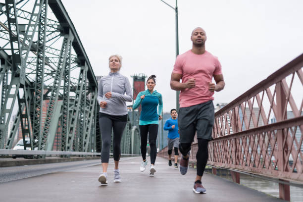 istock A group of co-ed runners goes for a training run in the city 1036412862