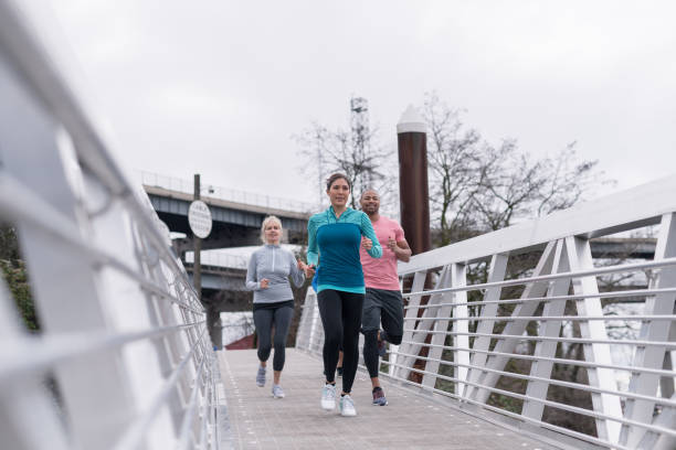 istock A group of co-ed runners goes for a training run in the city 1036412876